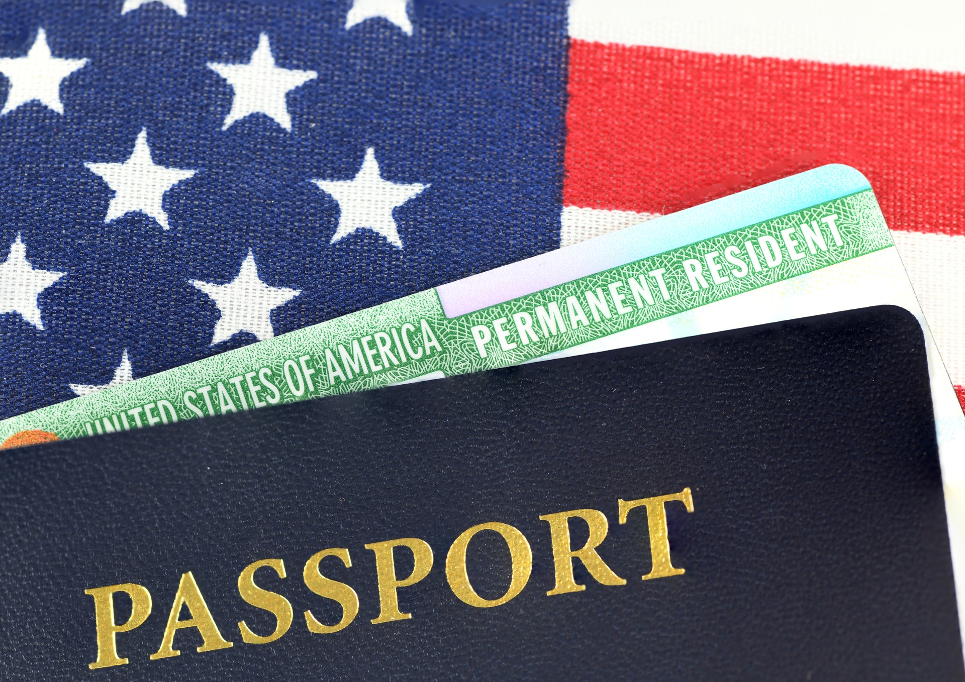 passport and green card of USA on the national flag